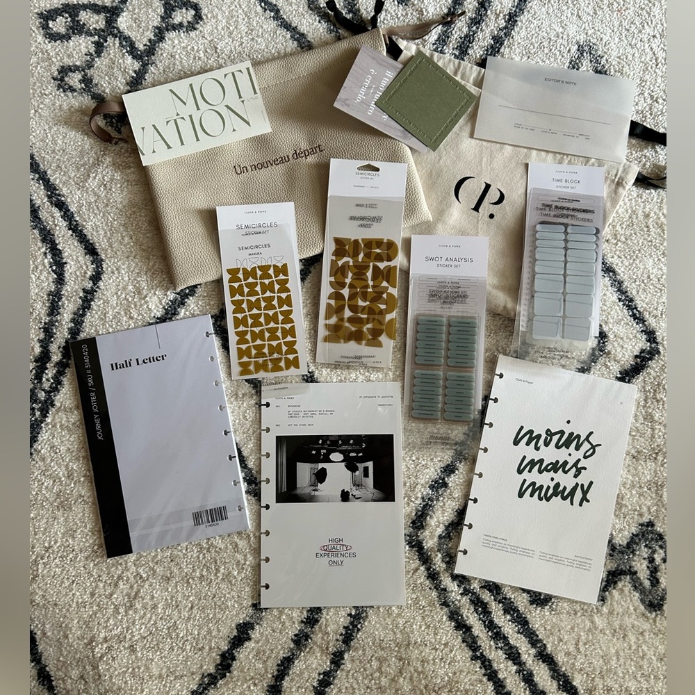 Cloth and paper dust bags, half letter inserts and stickers